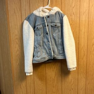 Selling a Jean jacket with a hood and fuzzy sleeves